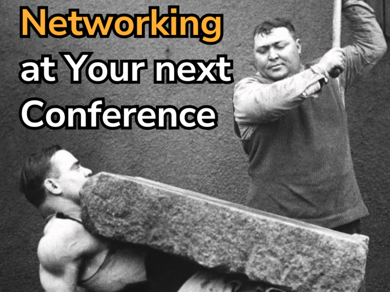 Picture of a man holding a large stone on his stomach while another holds a hammer above it, about to swing it down on the block