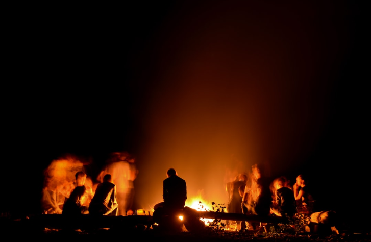 campfire with people around it